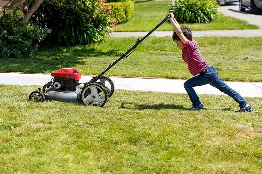 Kid mowing the lawn