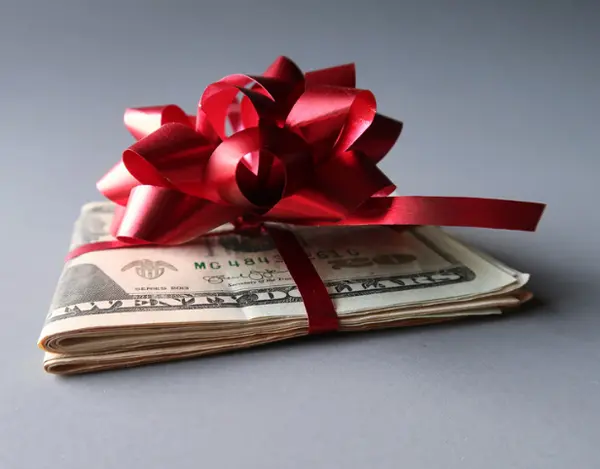 Money with a red bow